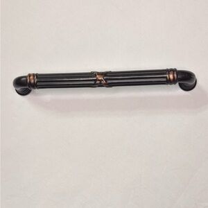 Emtek Ribbon and Reed oil-rubbed bronze cabinet or door pull handle.